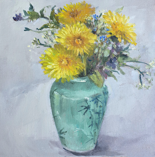 Dandelions in a green vase