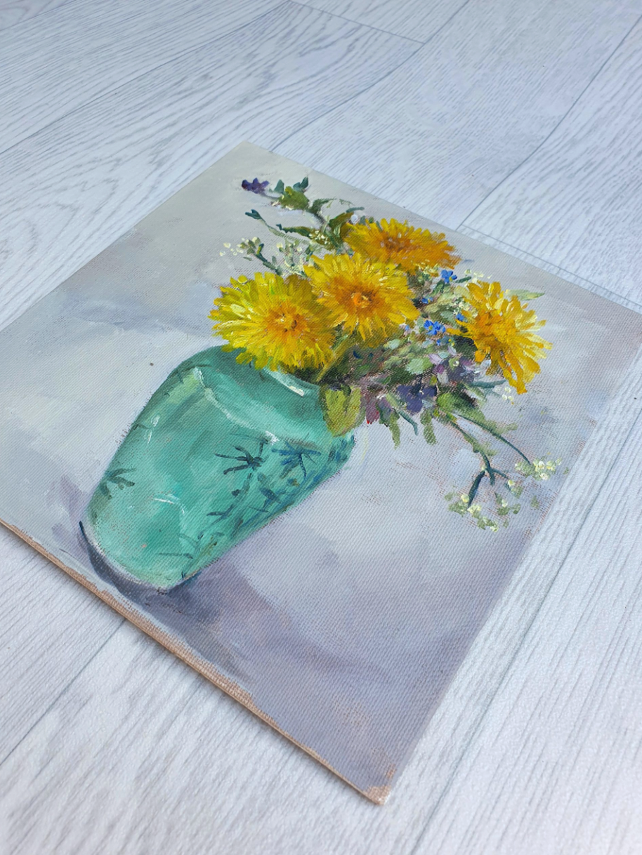 Dandelions in a green vase