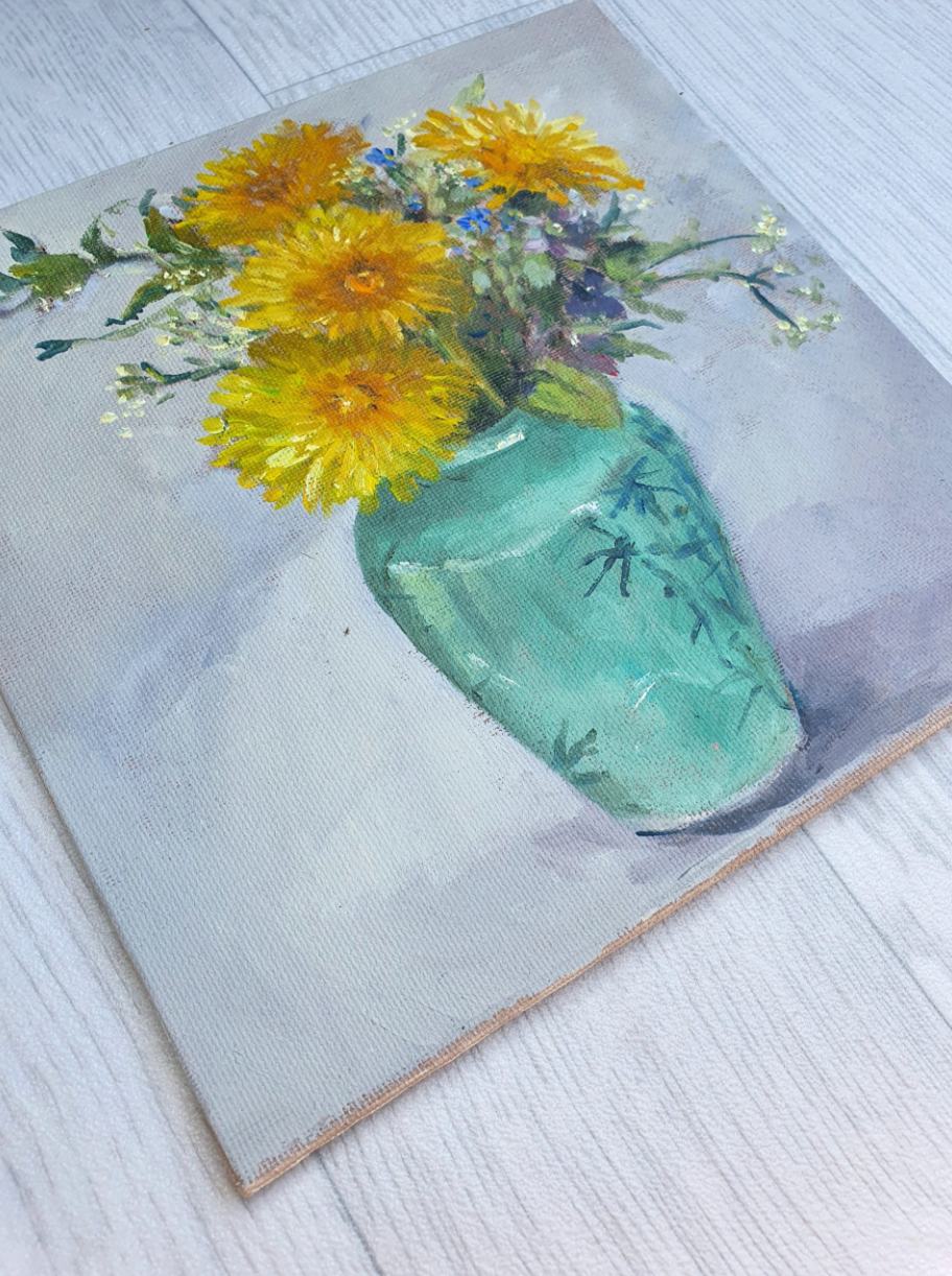 Dandelions in a green vase